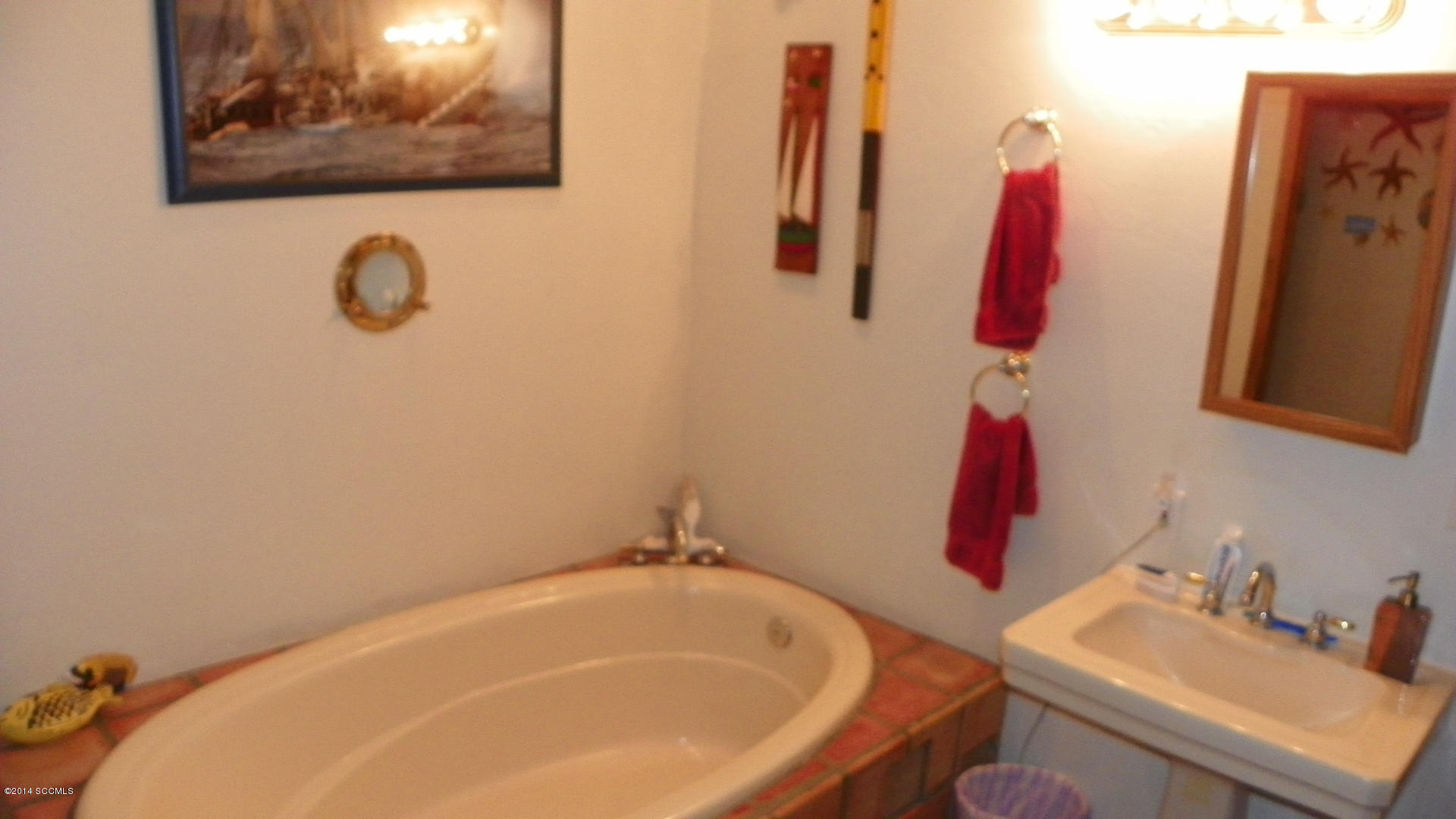 1623 Bufeo Court Rio Rico, AZ 85648 - Photo 21 of 52 a bathroom with a sink and a mirror