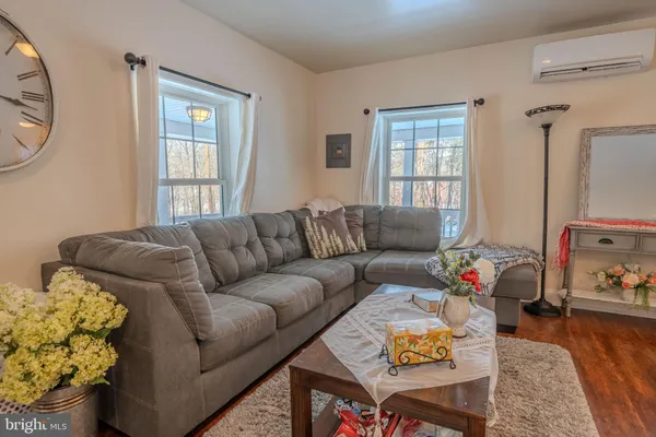 a living room with furniture and a window