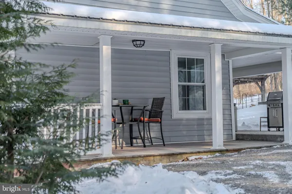 a view of house with outdoor space and seating space