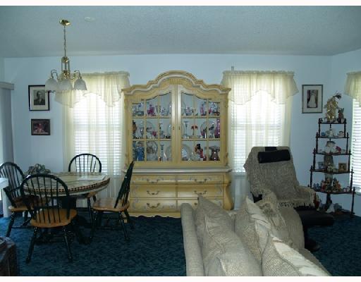 2826 Stoneway Lane, Unit B Fort Pierce, FL 34982 - Photo 3 of 7 a living room with furniture and a window