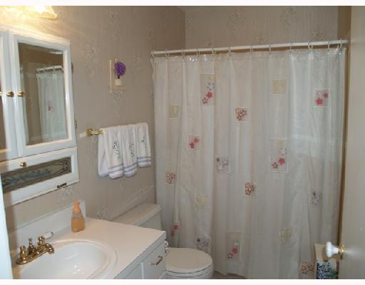2826 Stoneway Lane, Unit B Fort Pierce, FL 34982 - Photo 5 of 7 a bathroom with a sink and a mirror