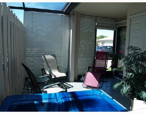 2826 Stoneway Lane, Unit B Fort Pierce, FL 34982 - Photo 6 of 7 a view of outdoor space with furniture and garden
