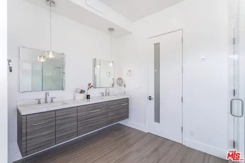 a bathroom with a tub shower and window