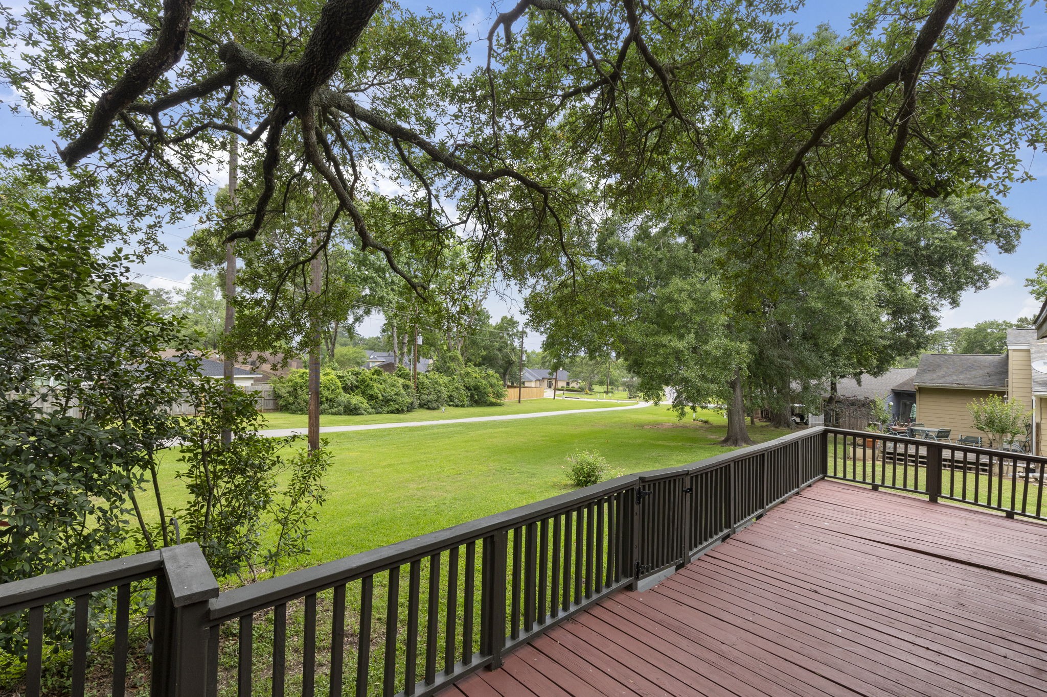49 April Village Conroe, TX 77356 - Photo 20 of 46 a view of a balcony with wooden floor