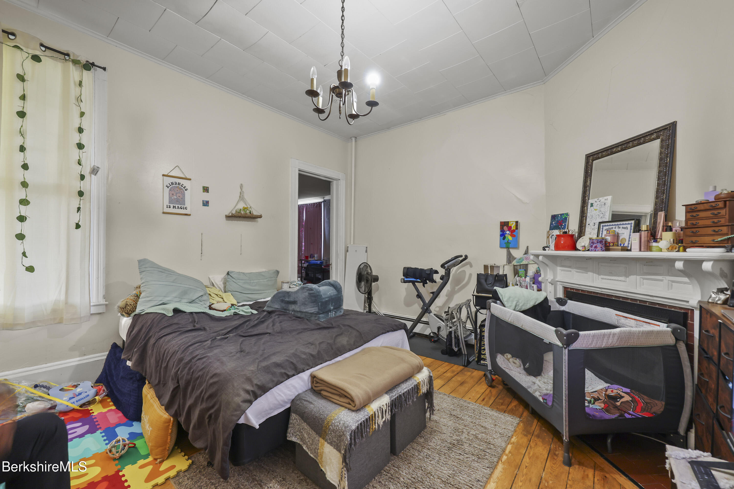 104 Appleton Avenue Pittsfield, MA 01201 - Photo 14 of 50 a living room with furniture and a chandelier