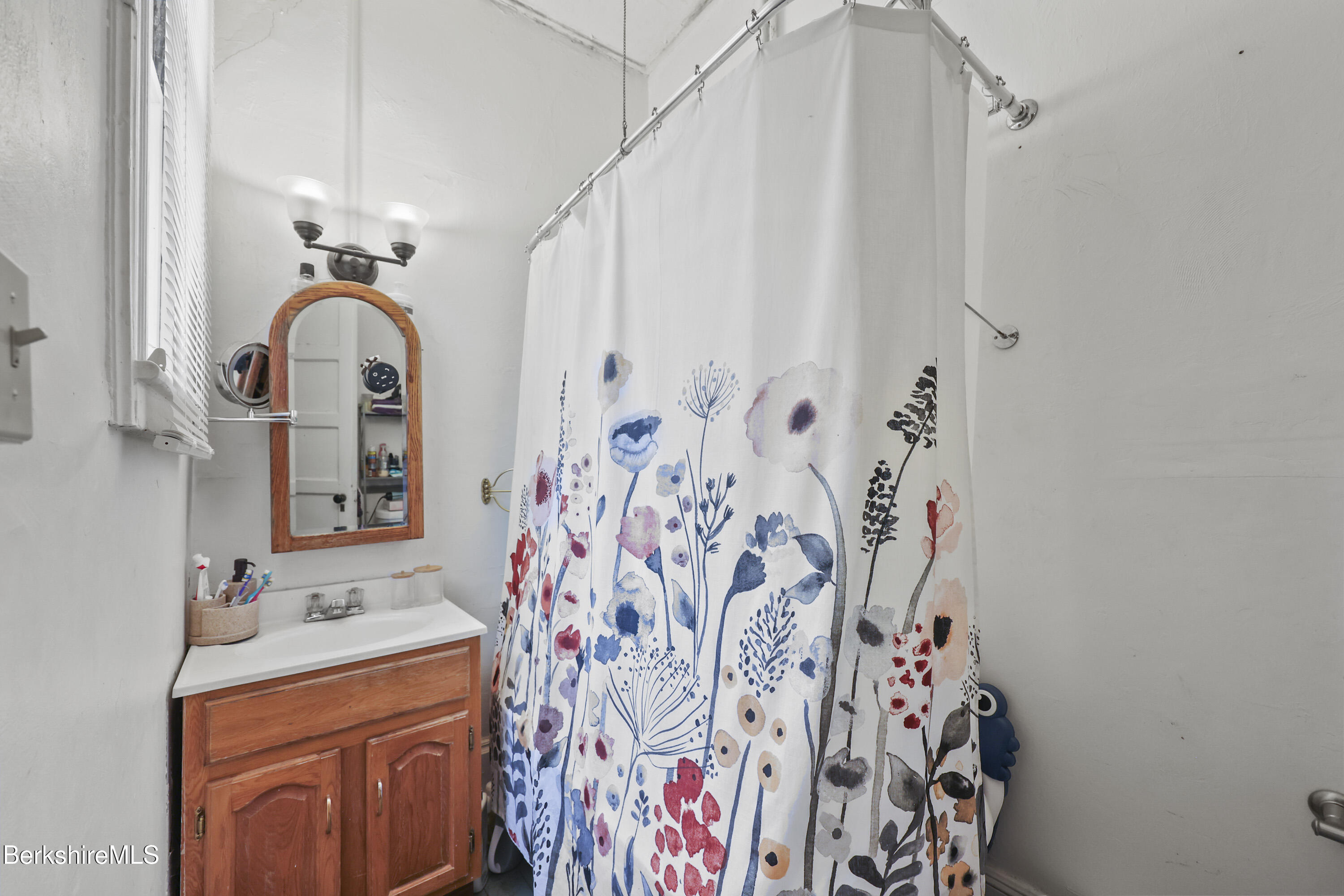 104 Appleton Avenue Pittsfield, MA 01201 - Photo 17 of 50 a bathroom with a sink and a mirror