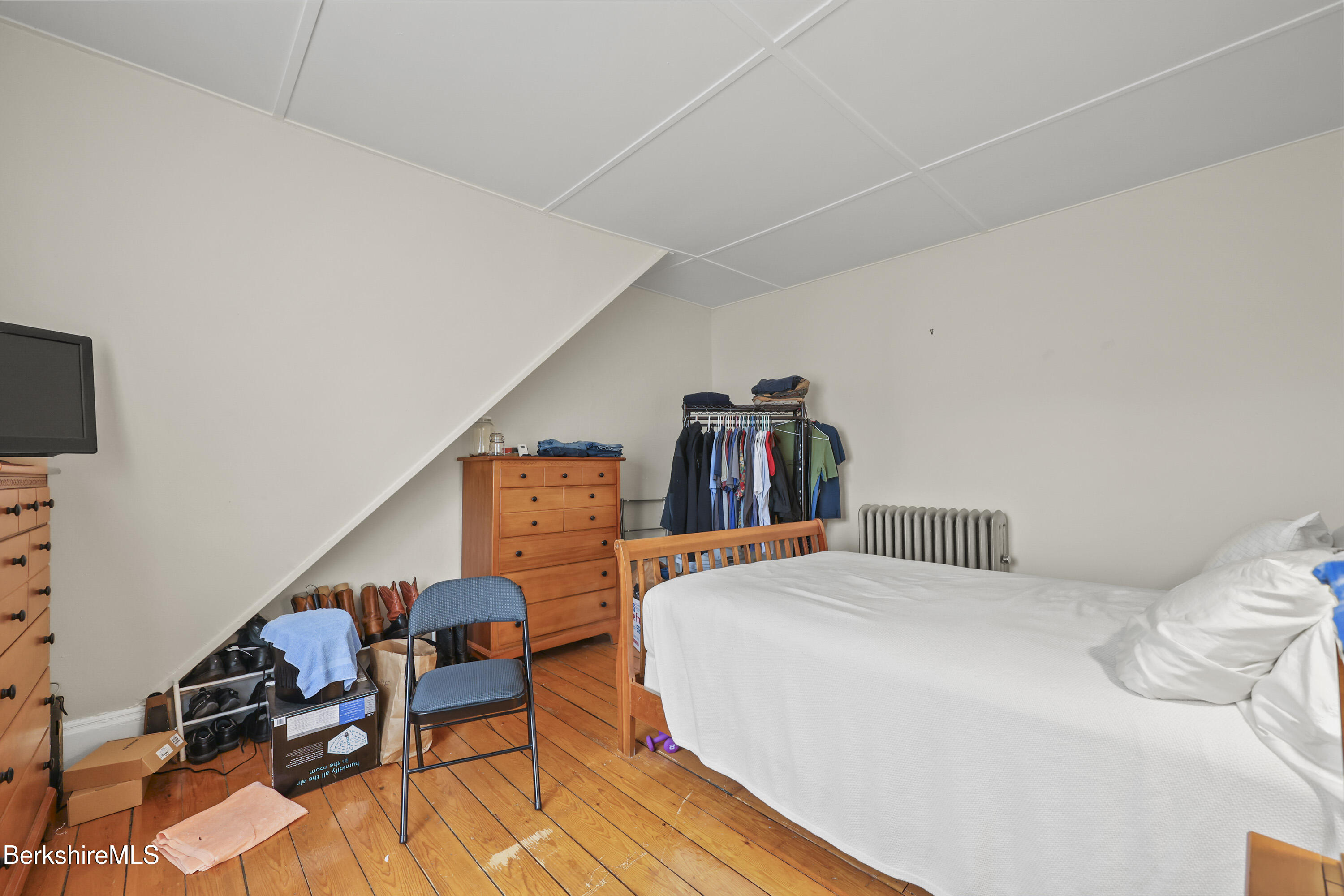 104 Appleton Avenue Pittsfield, MA 01201 - Photo 24 of 50 a bedroom with furniture and a book shelf