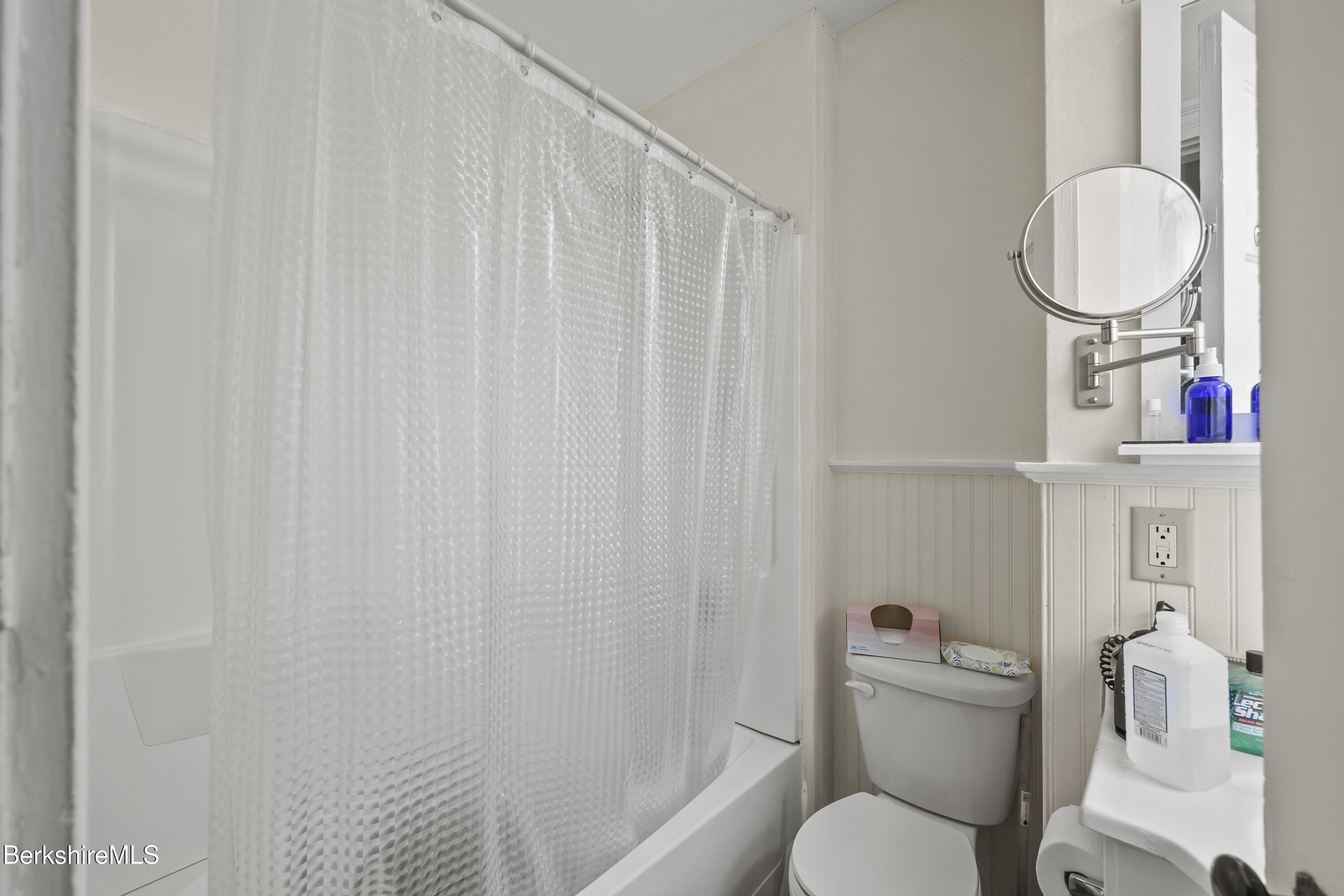 104 Appleton Avenue Pittsfield, MA 01201 - Photo 26 of 50 a bathroom with a toilet a sink and a shower curtain