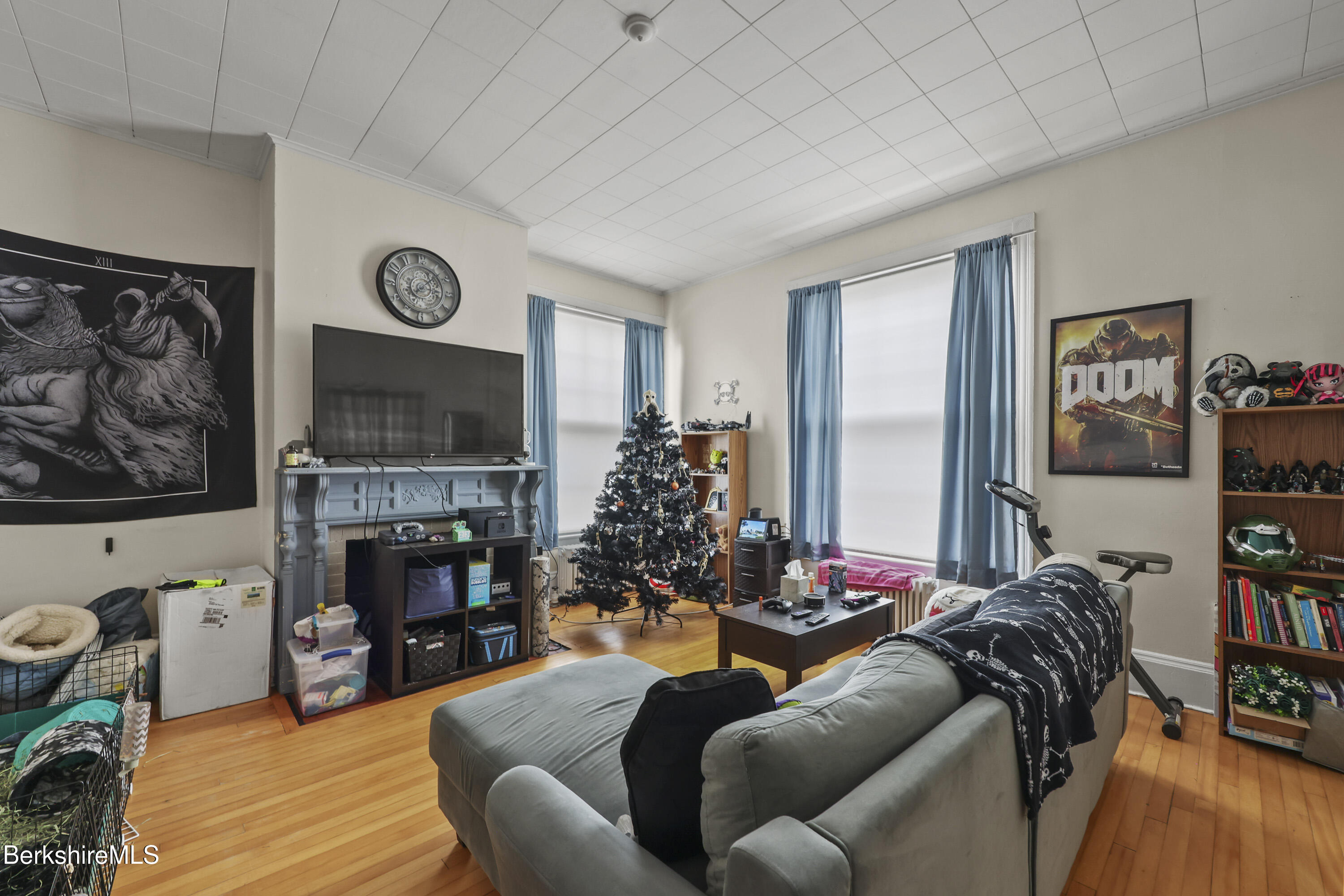 104 Appleton Avenue Pittsfield, MA 01201 - Photo 4 of 50 a living room with furniture a flat screen tv and a fireplace