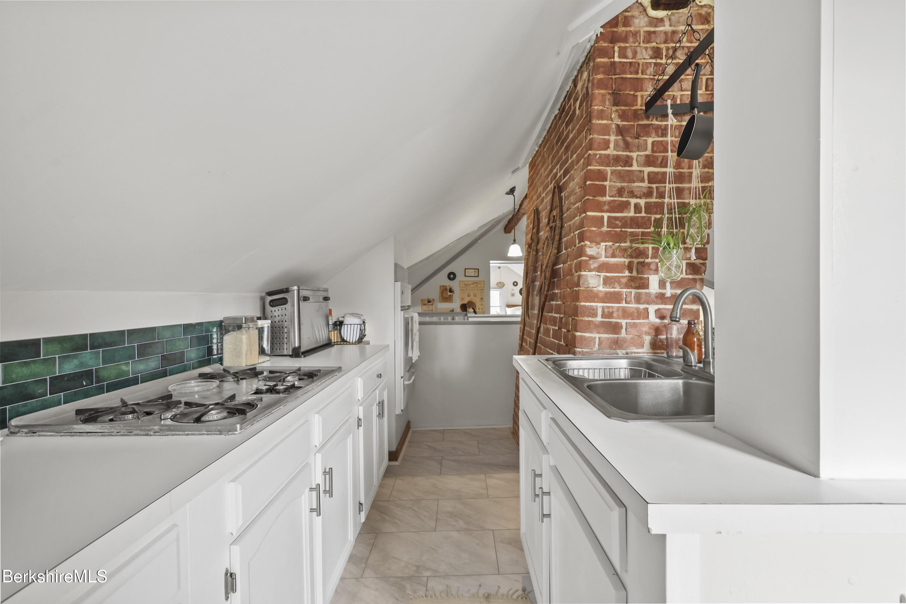 104 Appleton Avenue Pittsfield, MA 01201 - Photo 41 of 50 a kitchen with a sink stove and cabinets