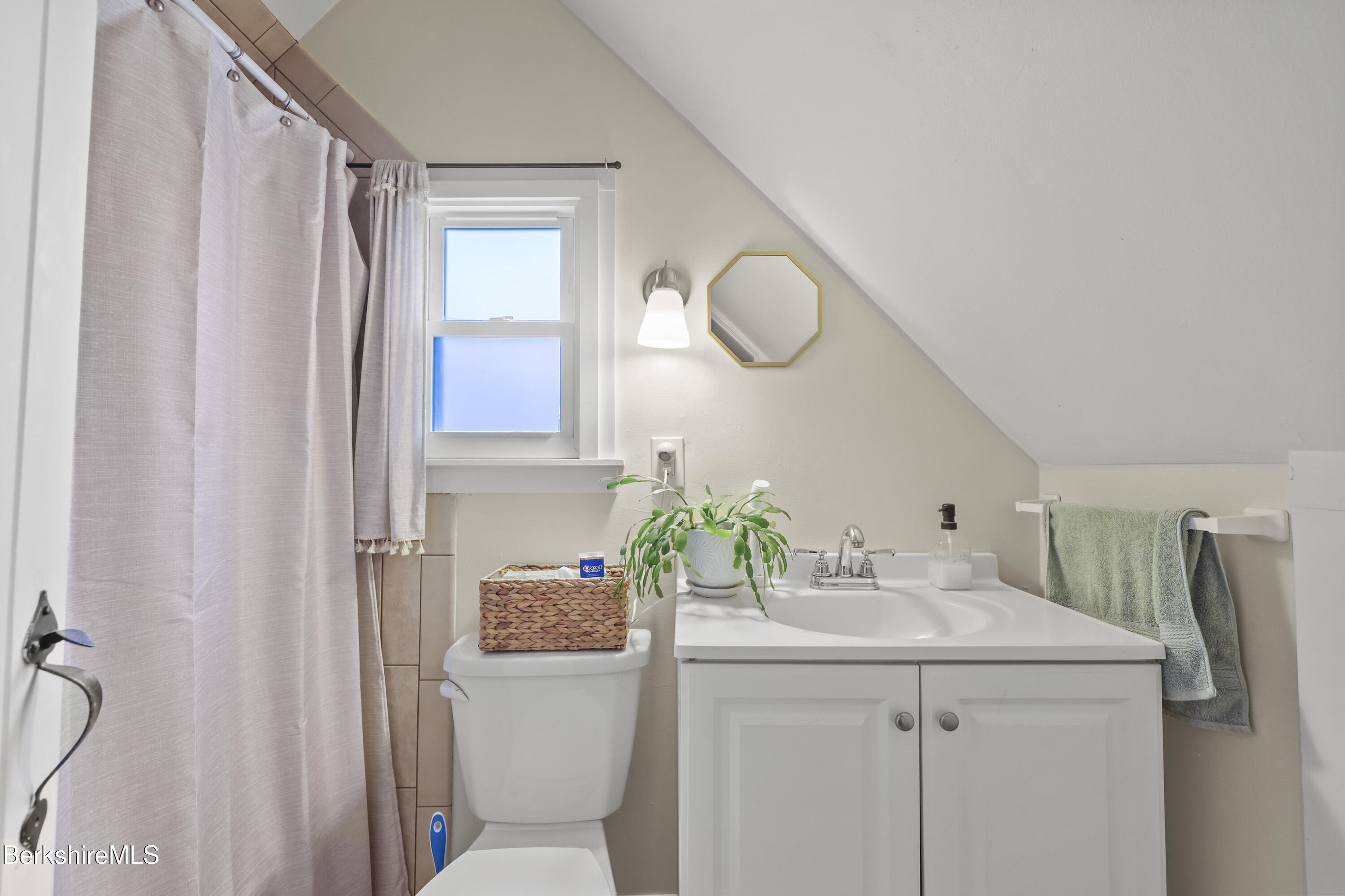 104 Appleton Avenue Pittsfield, MA 01201 - Photo 45 of 50 a bathroom with a sink a toilet and a mirror