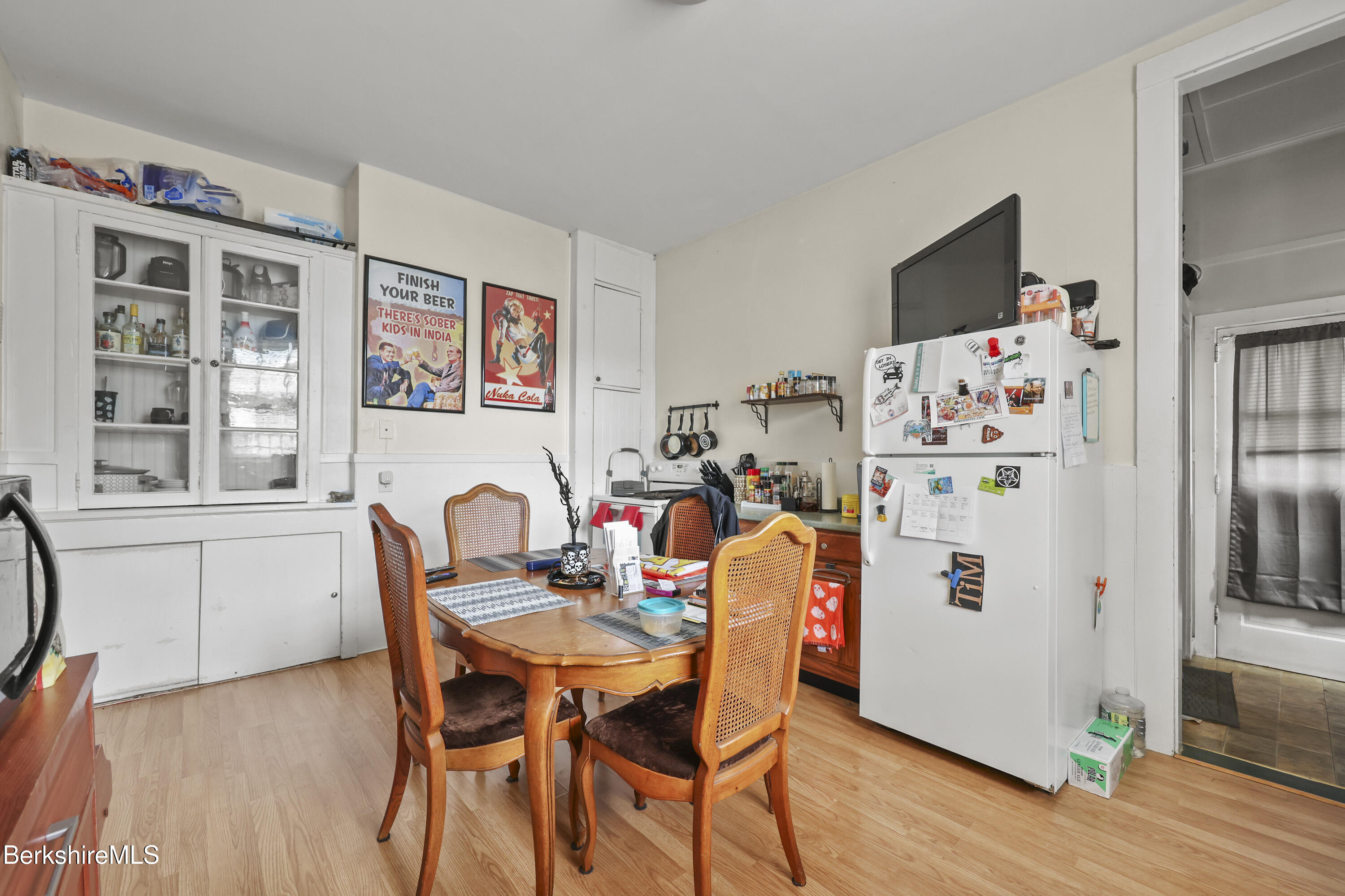 104 Appleton Avenue Pittsfield, MA 01201 - Photo 9 of 50 a dining room with furniture a wooden floor and a window