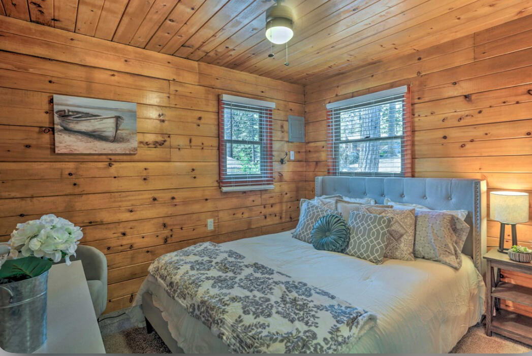 42036 Tollhouse Road Shaver Lake, CA 93664 - Photo 14 of 30 a bedroom with a bed and a dresser