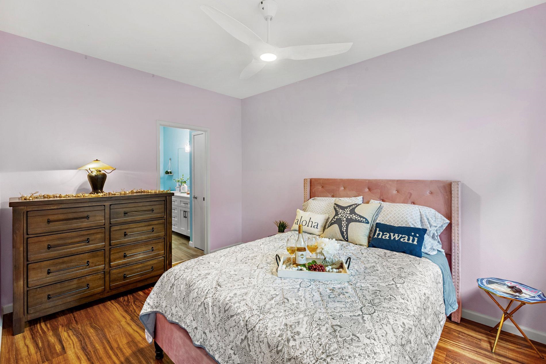 127 Punohu Lane, Unit 72 Lahaina, HI 96761 - Photo 12 of 43 a bed room with a bed and a dresser