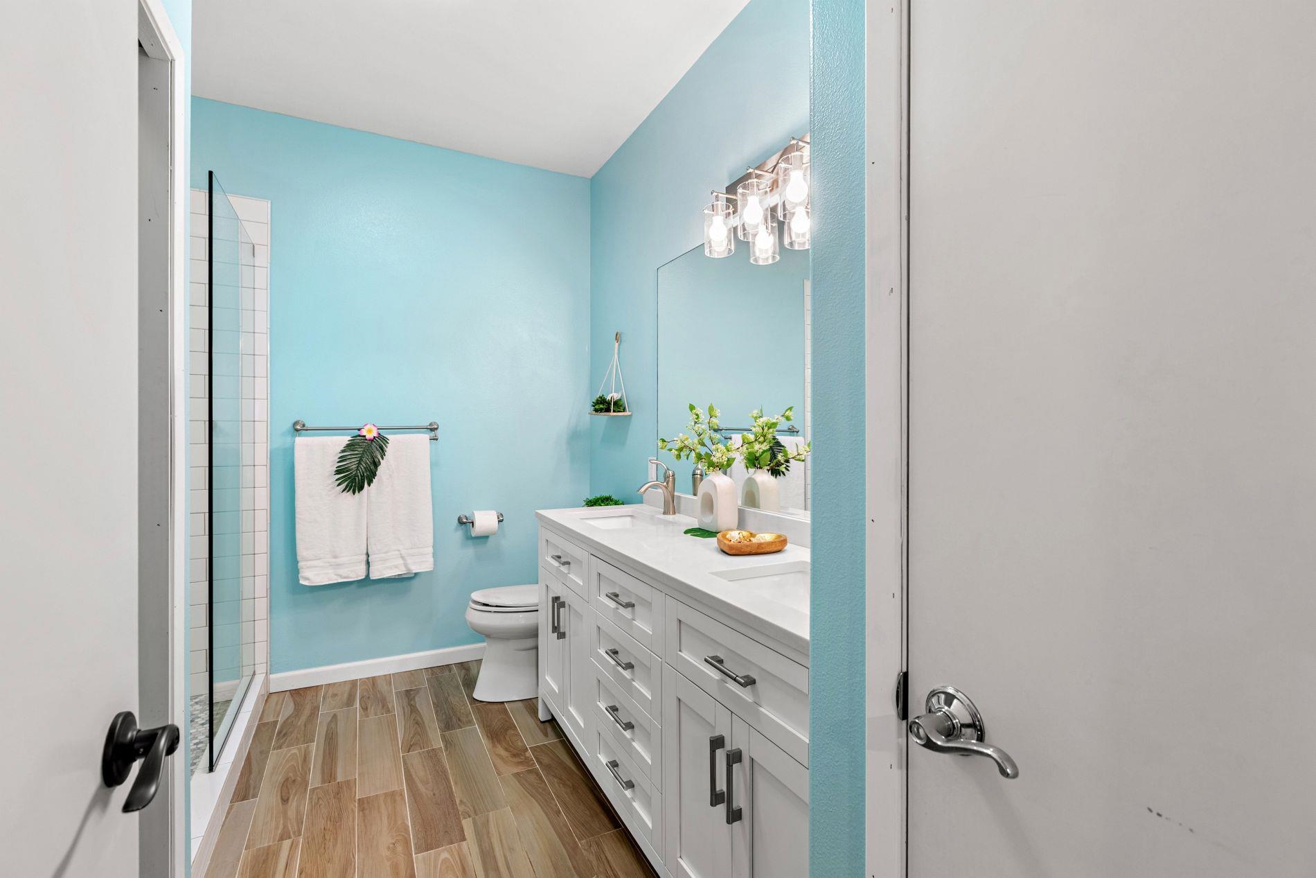 127 Punohu Lane, Unit 72 Lahaina, HI 96761 - Photo 14 of 43 a spacious bathroom with a sink mirror and toilet
