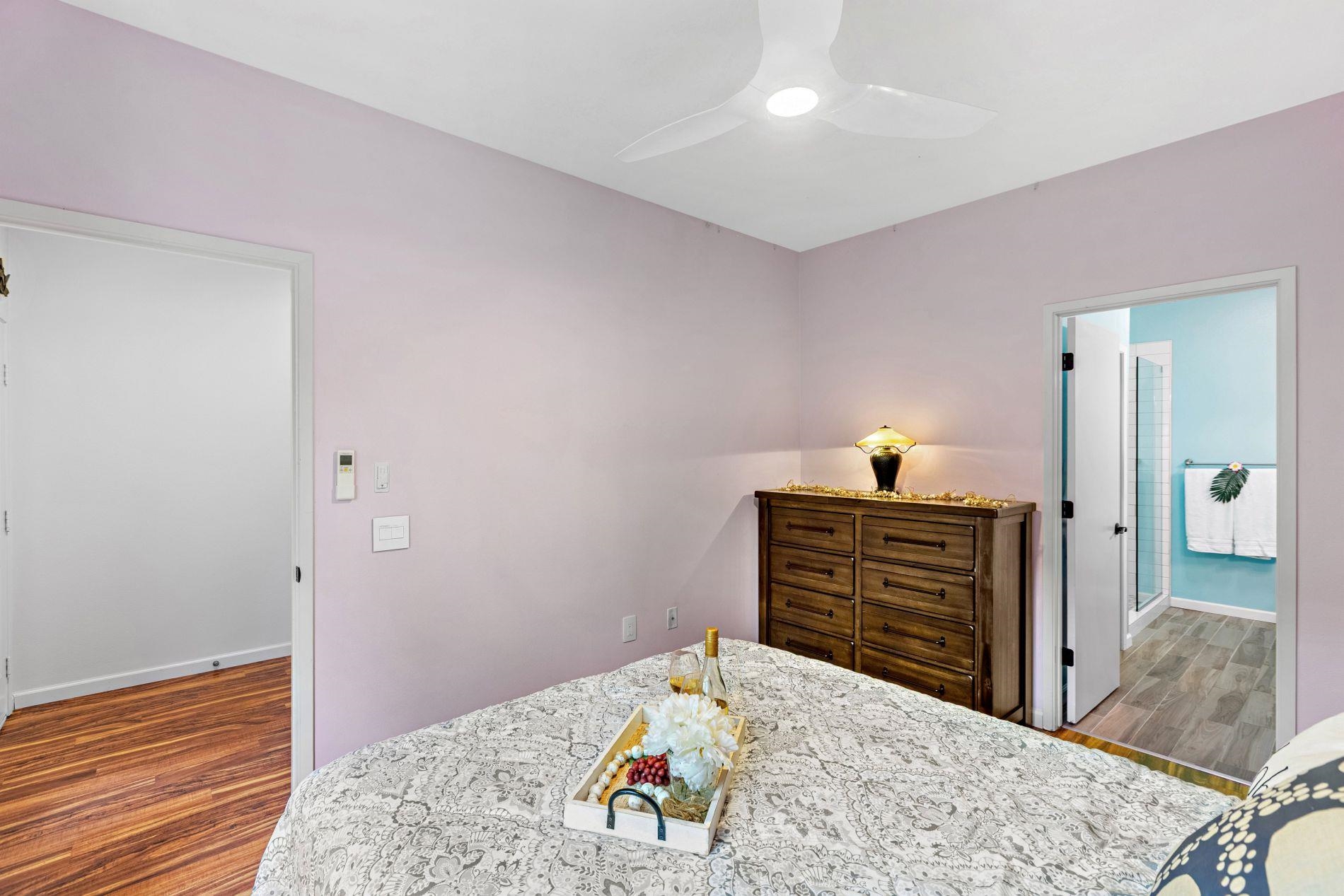 127 Punohu Lane, Unit 72 Lahaina, HI 96761 - Photo 17 of 43 a bedroom with a bed and wooden floor