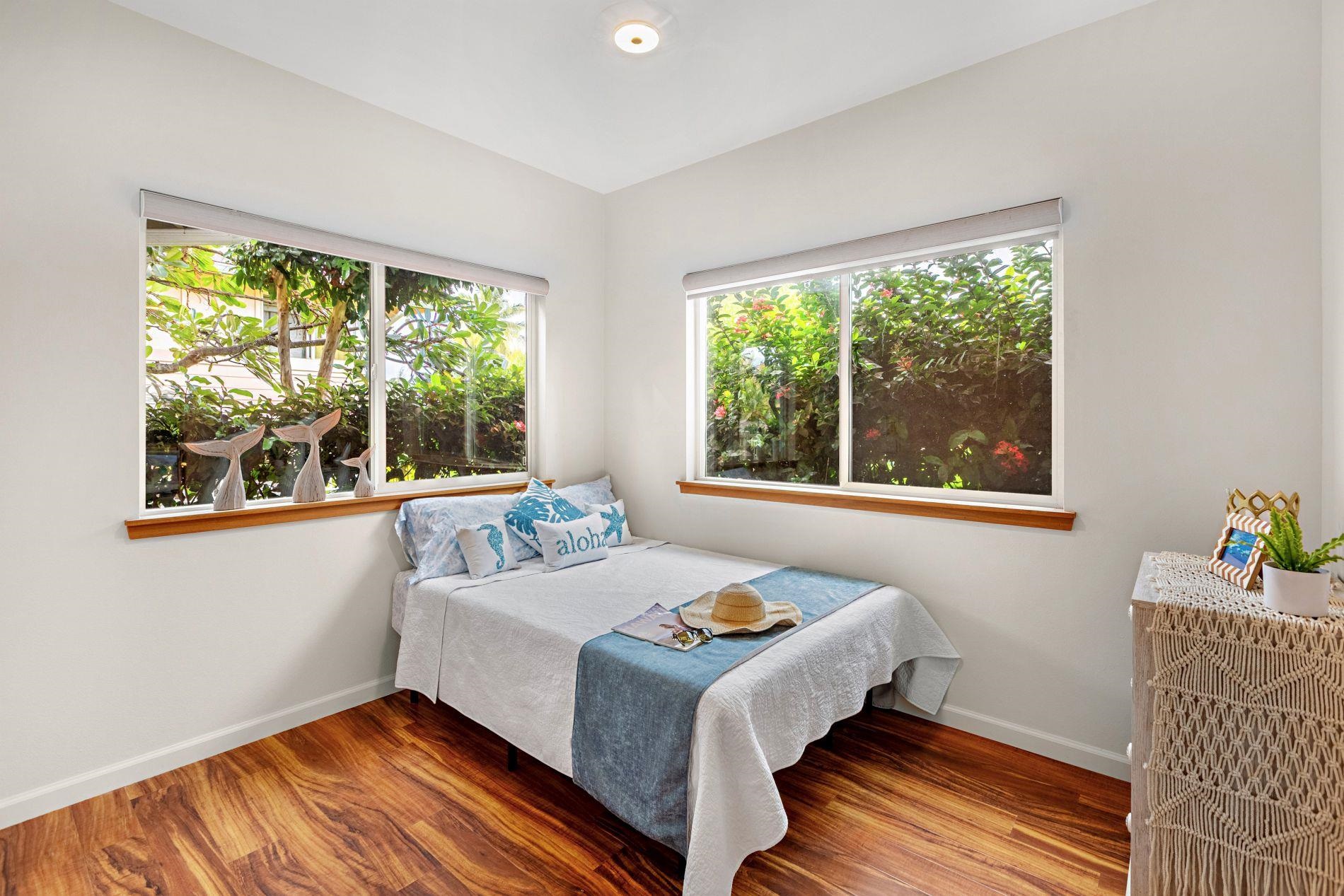 127 Punohu Lane, Unit 72 Lahaina, HI 96761 - Photo 18 of 43 a bedroom with a bed and a window