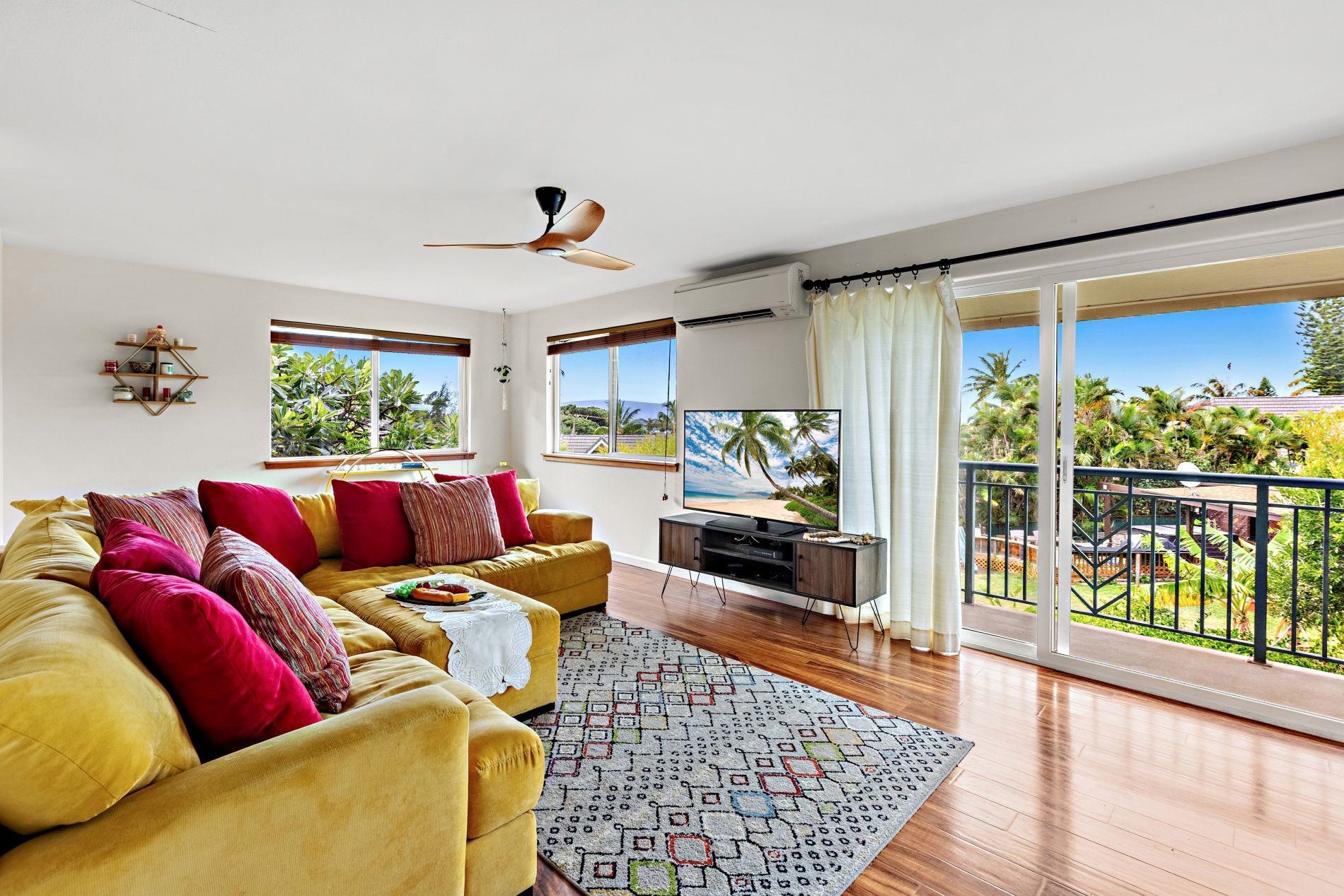 127 Punohu Lane, Unit 72 Lahaina, HI 96761 - Photo 2 of 43 a living room with furniture and a large window