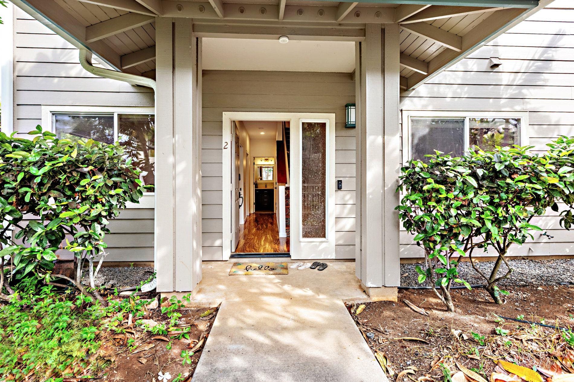 127 Punohu Lane, Unit 72 Lahaina, HI 96761 - Photo 28 of 43 a front view of a house with garden