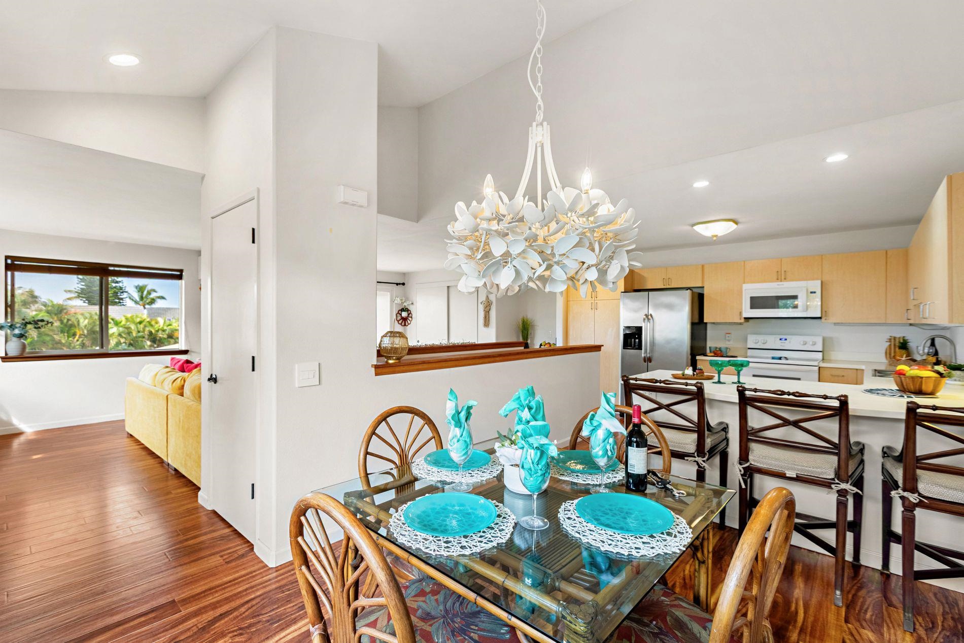 127 Punohu Lane, Unit 72 Lahaina, HI 96761 - Photo 3 of 43 a view of a dining room with furniture and a chandelier