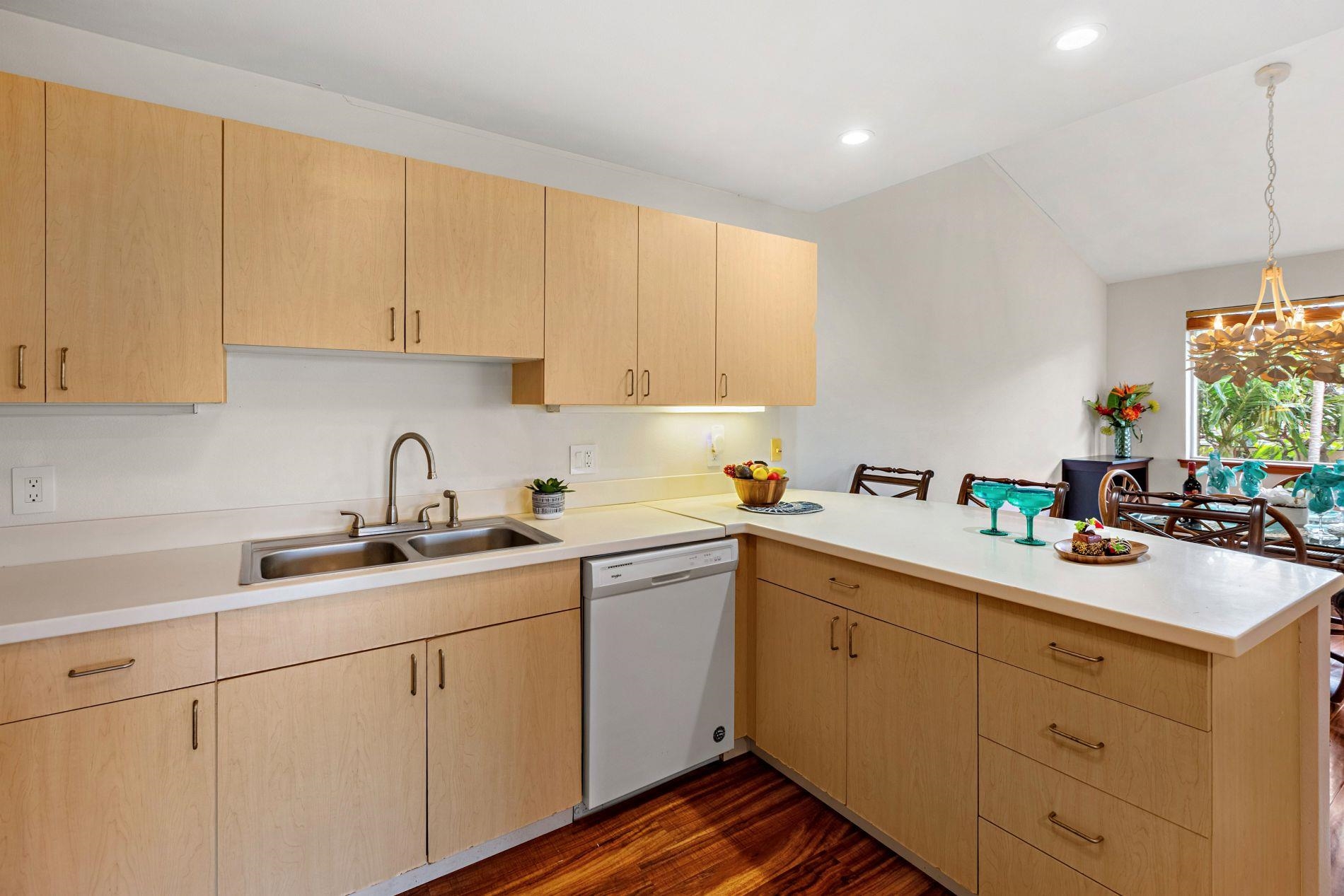 127 Punohu Lane, Unit 72 Lahaina, HI 96761 - Photo 32 of 43 a kitchen with a sink cabinets and window