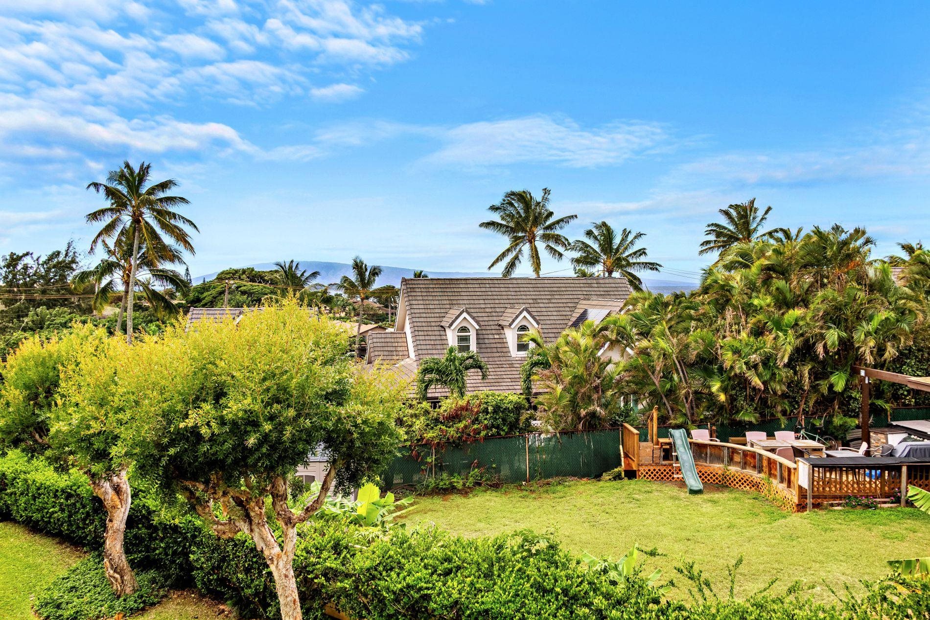 127 Punohu Lane, Unit 72 Lahaina, HI 96761 - Photo 40 of 43 a view of a house with a yard