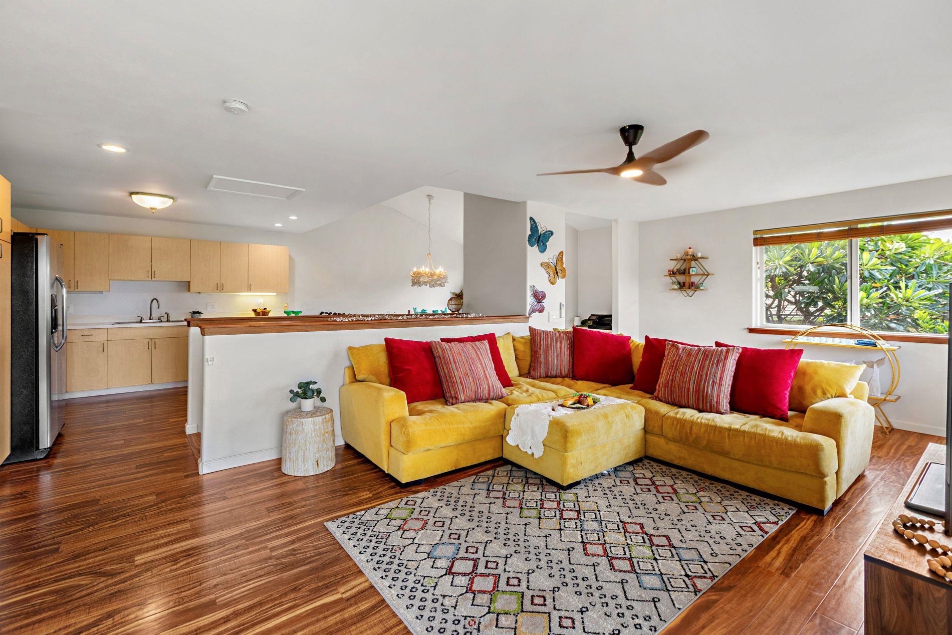 127 Punohu Lane, Unit 72 Lahaina, HI 96761 - Photo 4 of 43 a living room with furniture and a large window