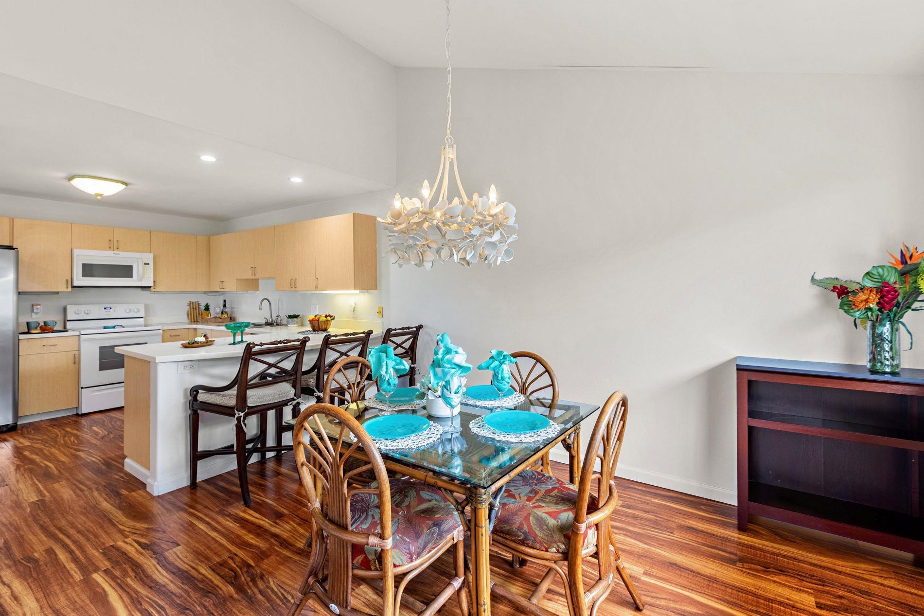 127 Punohu Lane, Unit 72 Lahaina, HI 96761 - Photo 5 of 43 a view of a dining room with furniture and wooden floor