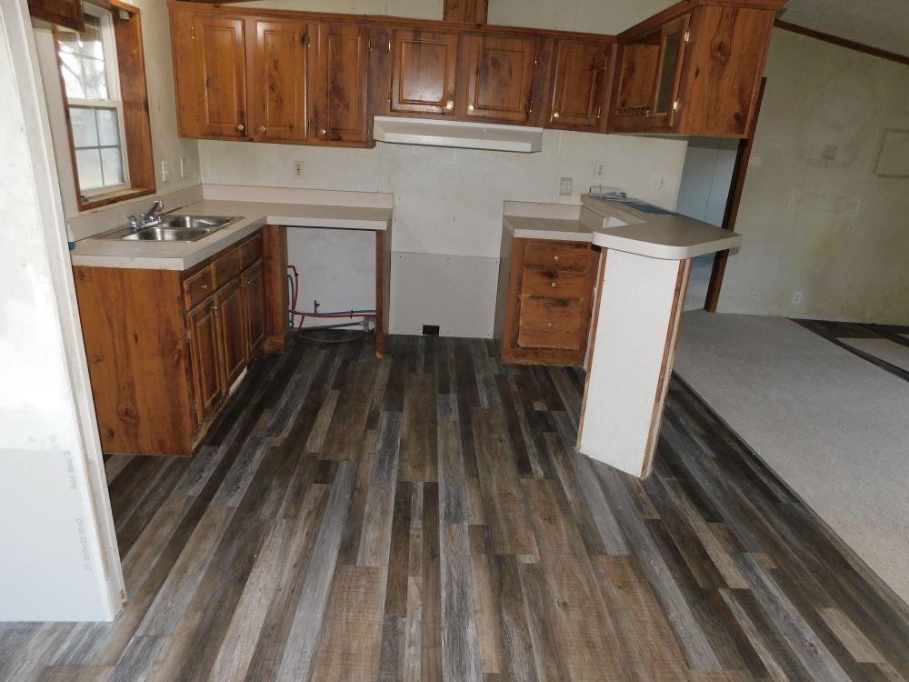 108 Valley Road Darlington, PA 16115 - Photo 2 of 10 a kitchen with wooden cabinets and a stove top oven