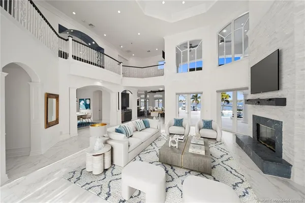 a living room with fireplace furniture and a flat screen tv