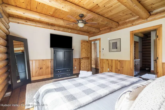 a living room with furniture a wooden floor and a window