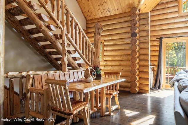 a bedroom with a bed next to a window