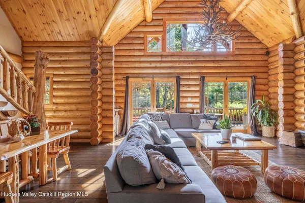 a living room with fireplace furniture and a flat screen tv