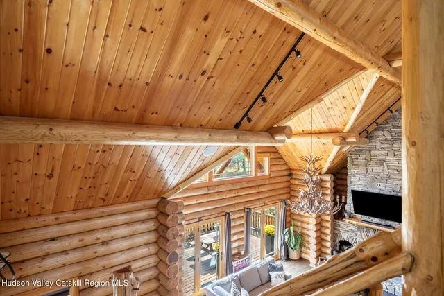 a living room with furniture a window and a dining table