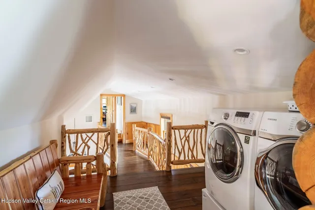 a view of a bedroom with furniture and a ceiling fan