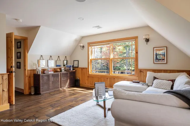 a outdoor sitting area with furniture and wooden floor