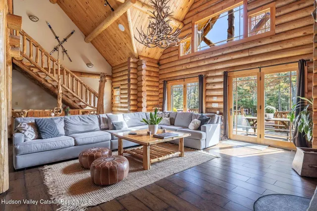 a kitchen with stainless steel appliances granite countertop a refrigerator and wooden floor