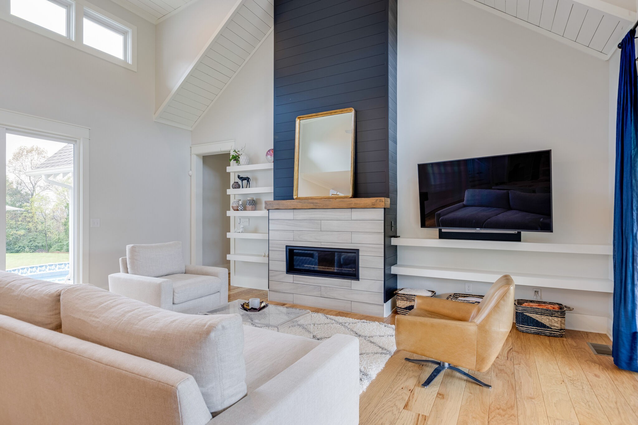 322 Springhouse Circle Franklin, TN 37067 - Photo 11 of 70 a living room with furniture a flat screen tv and a fireplace