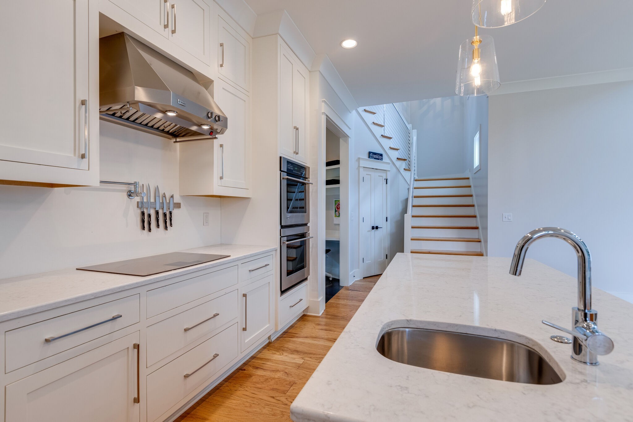 322 Springhouse Circle Franklin, TN 37067 - Photo 26 of 70 a kitchen with stainless steel appliances kitchen island granite countertop a sink a stove and cabinets