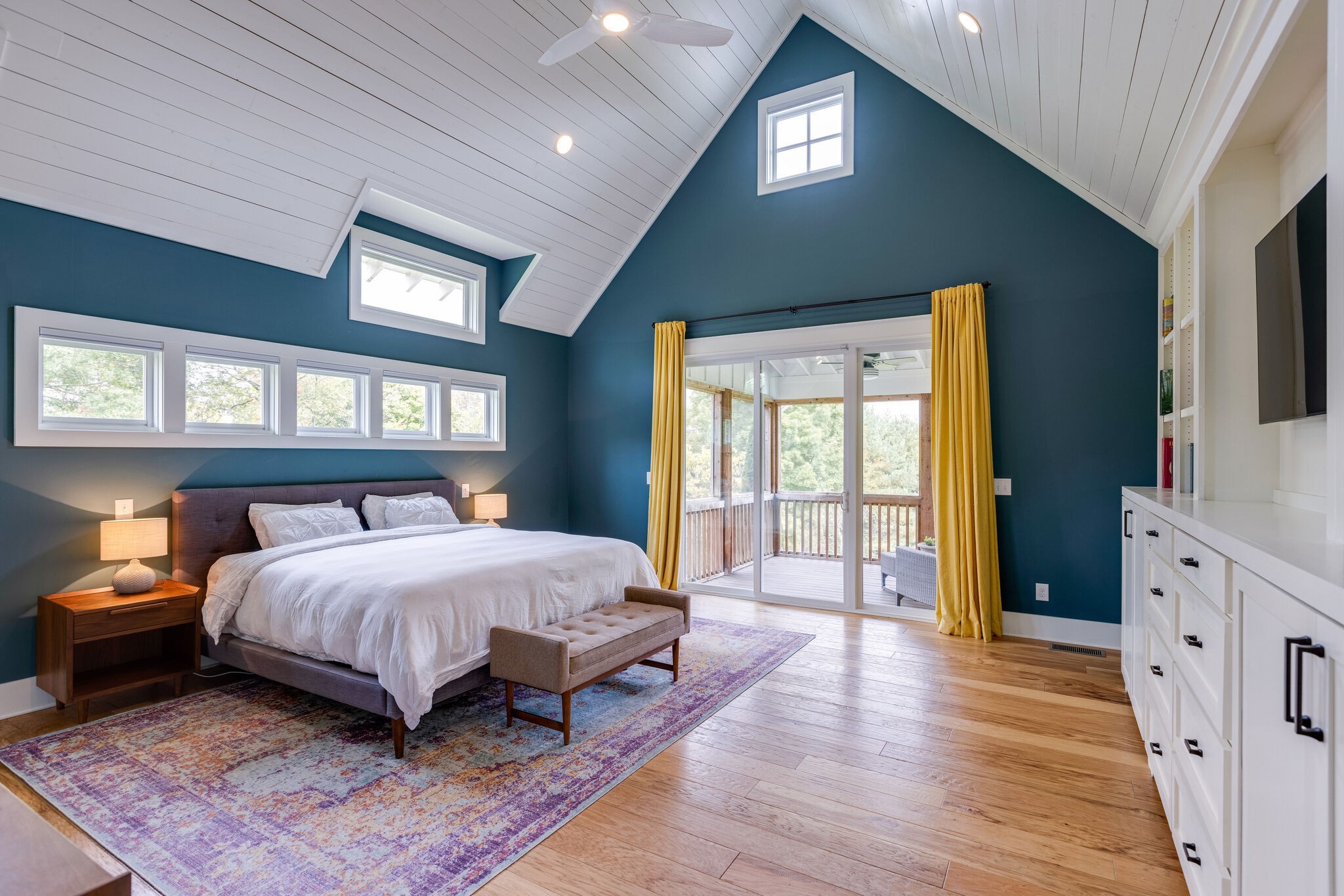 322 Springhouse Circle Franklin, TN 37067 - Photo 30 of 70 a spacious bedroom with a large bed and a chandelier