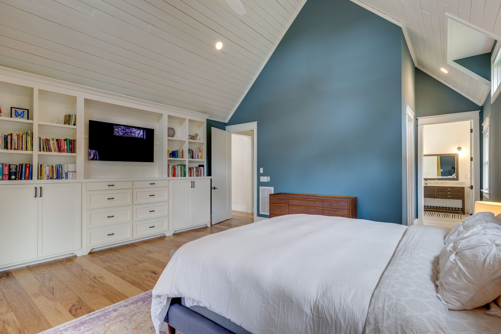 322 Springhouse Circle Franklin, TN 37067 - Photo 33 of 70 a bedroom with a bed and a flat screen tv