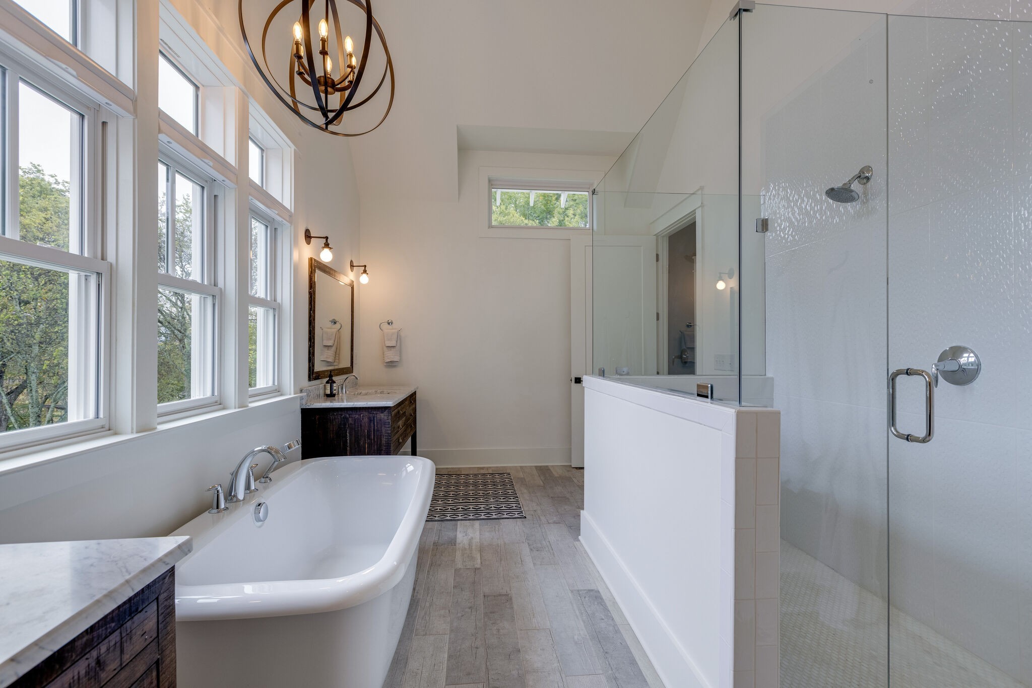 322 Springhouse Circle Franklin, TN 37067 - Photo 39 of 70 a bathroom with a granite countertop sink a mirror and a bathtub