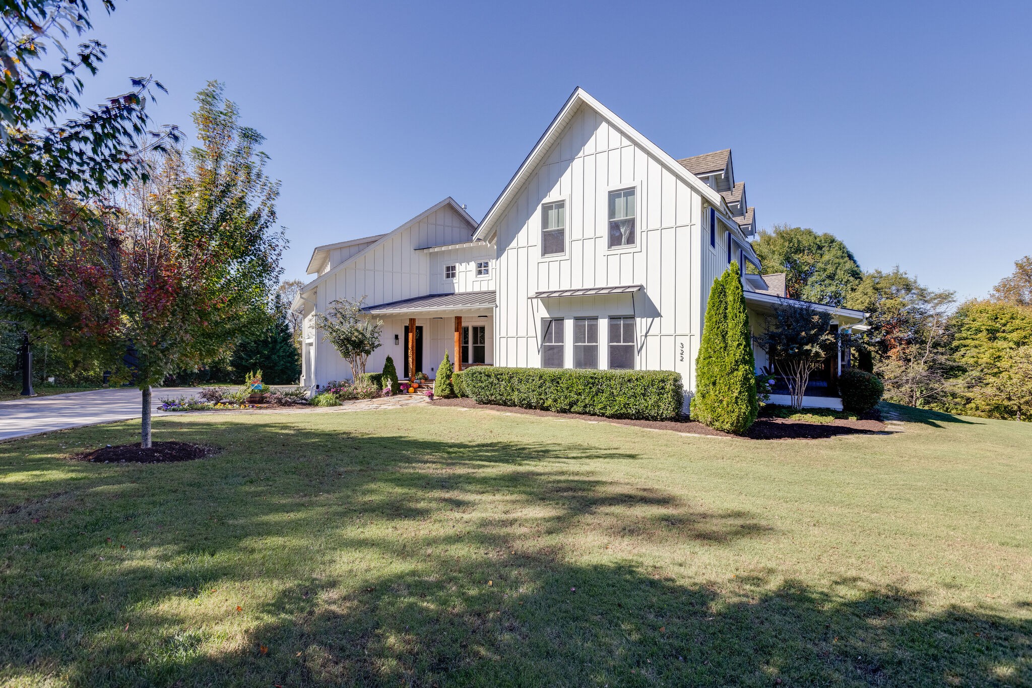 322 Springhouse Circle Franklin, TN 37067 - Photo 69 of 70 a view of a white house with a big yard and large trees