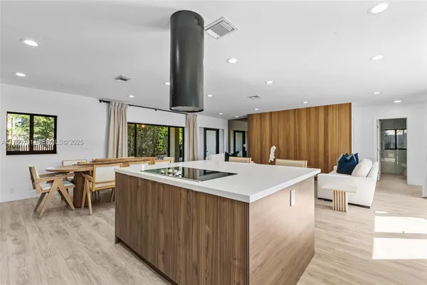 a view of a balcony with floor to ceiling windows with wooden floor