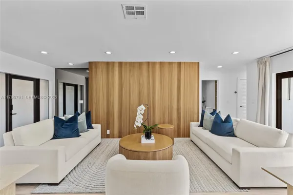 a living room with furniture and a table