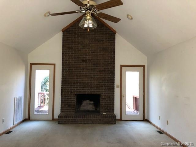 483 Shiloh Unity Road Lancaster, SC 29720 - Photo 11 of 22 a living room with furniture and a fireplace