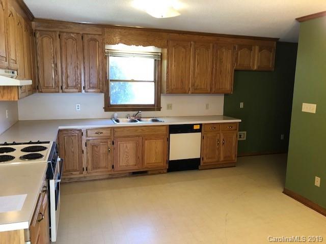 483 Shiloh Unity Road Lancaster, SC 29720 - Photo 16 of 22 a kitchen with stainless steel appliances granite countertop a stove a sink dishwasher and a refrigerator