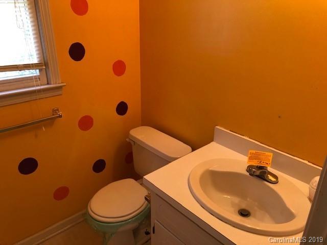483 Shiloh Unity Road Lancaster, SC 29720 - Photo 18 of 22 a bathroom with a sink a toilet and shower curtain