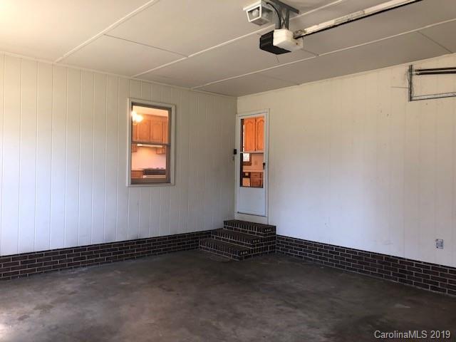 483 Shiloh Unity Road Lancaster, SC 29720 - Photo 21 of 22 a view of an empty room with wooden floor and a window