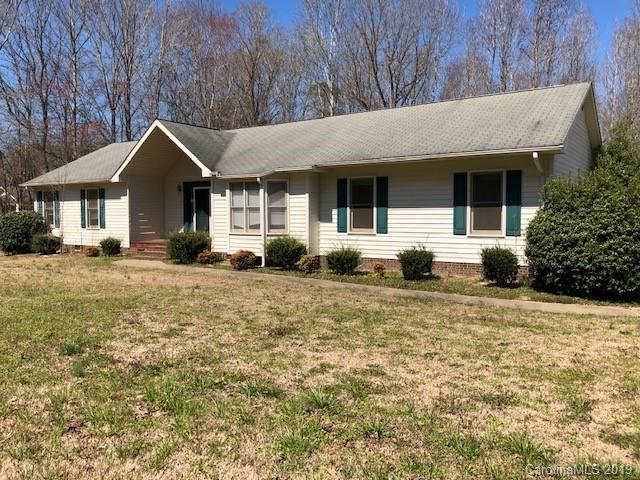 483 Shiloh Unity Road Lancaster, SC 29720 - Photo 5 of 22 a front view of a house with garden